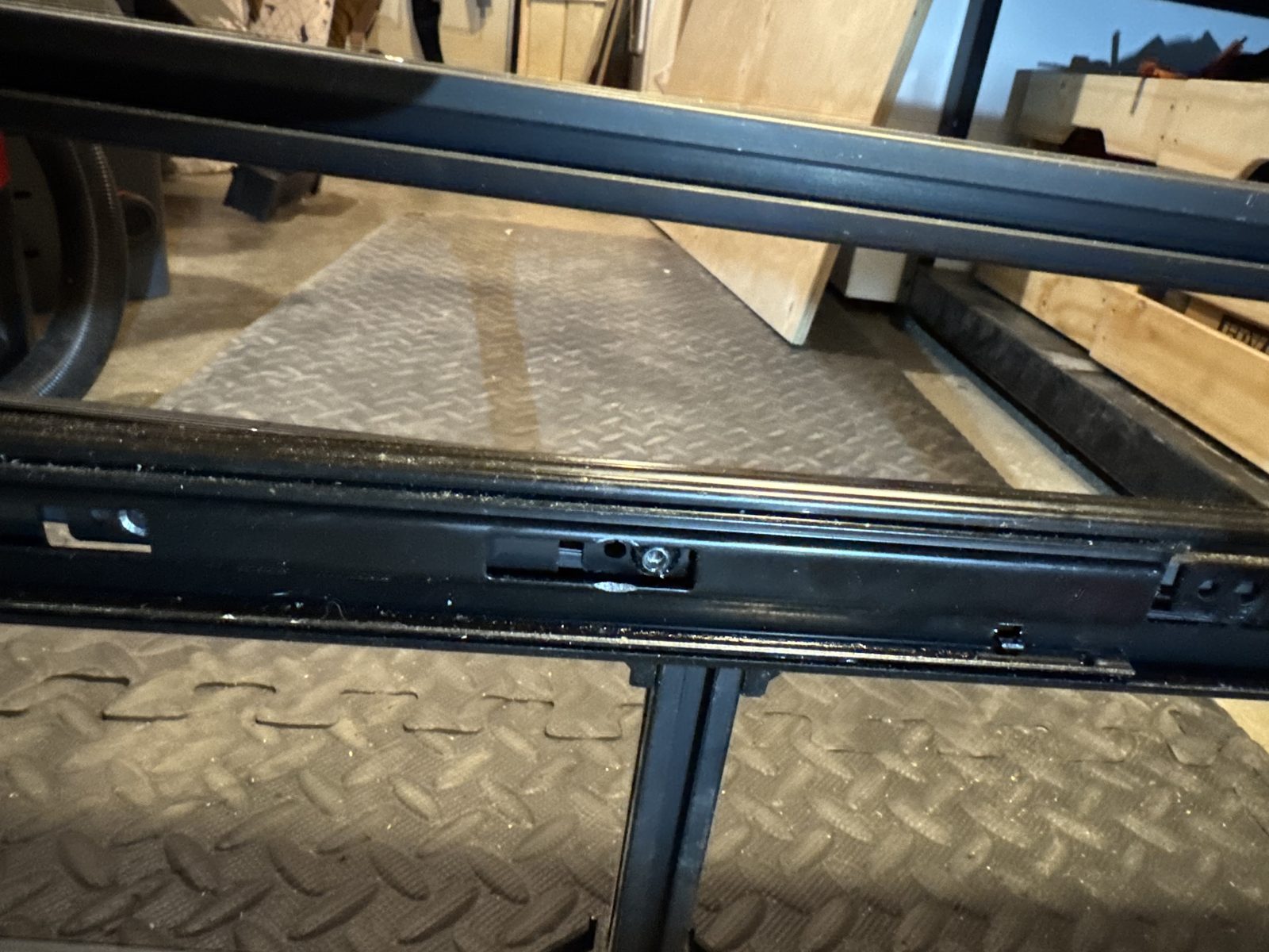 Drawer slide bolted to the extrusion through T-nuts