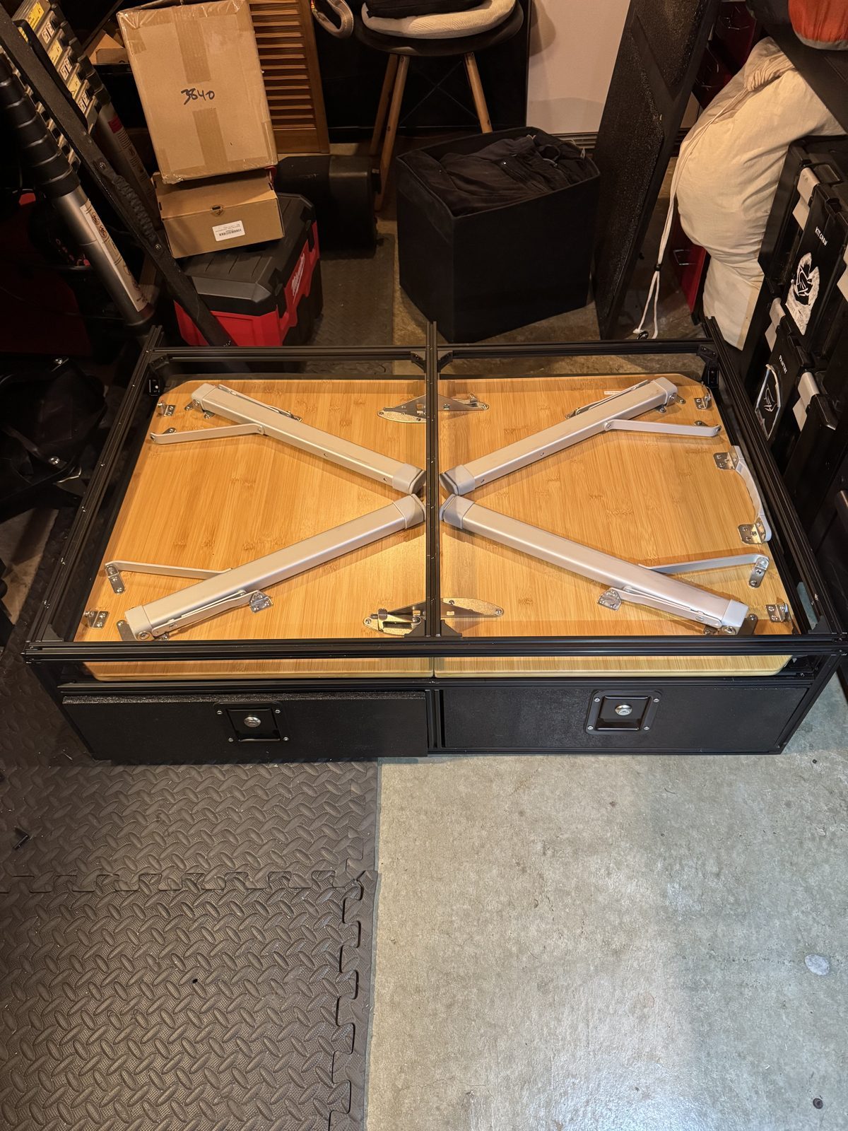 The Dometic GO table stored face-down in the slot, legs folded
