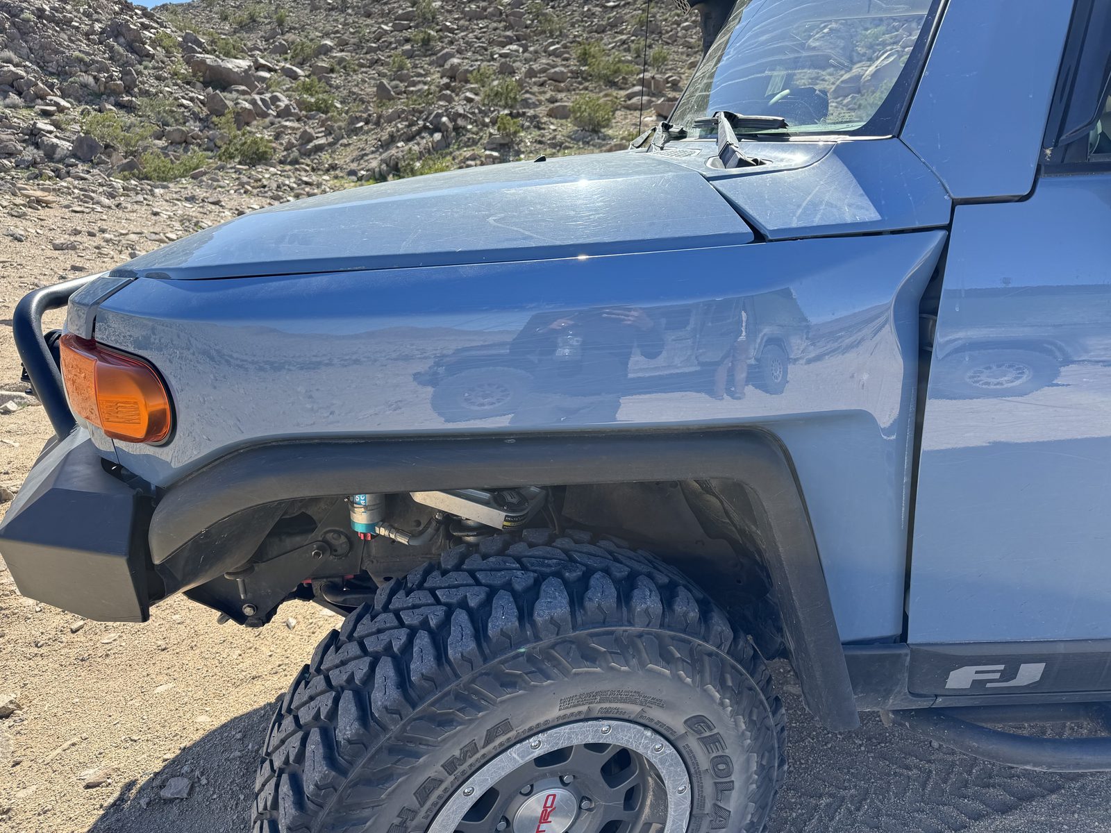The FJ's crumpled driver-side front fender