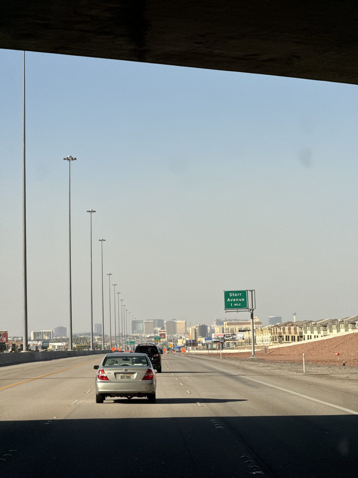 The highway into the Las Vegas valley through a windshield