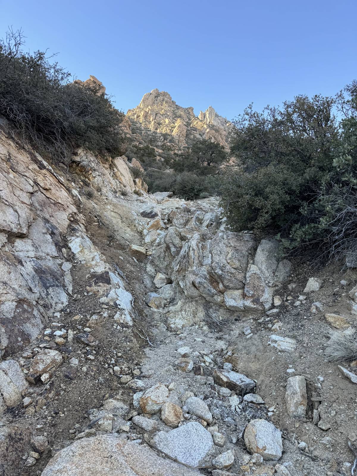 A loose, rocky climb between granite walls