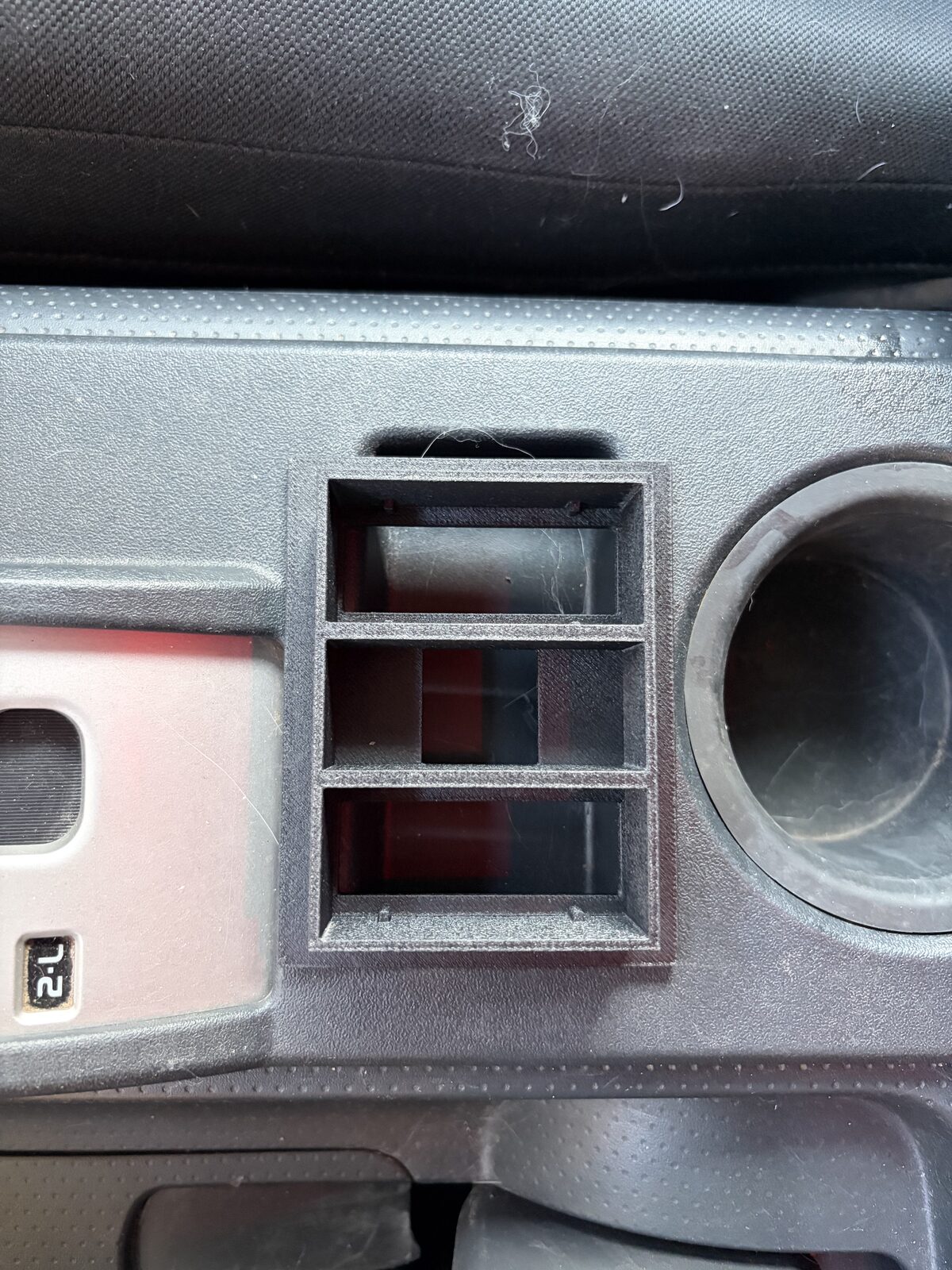 The first bezel print test-fitted in the console opening