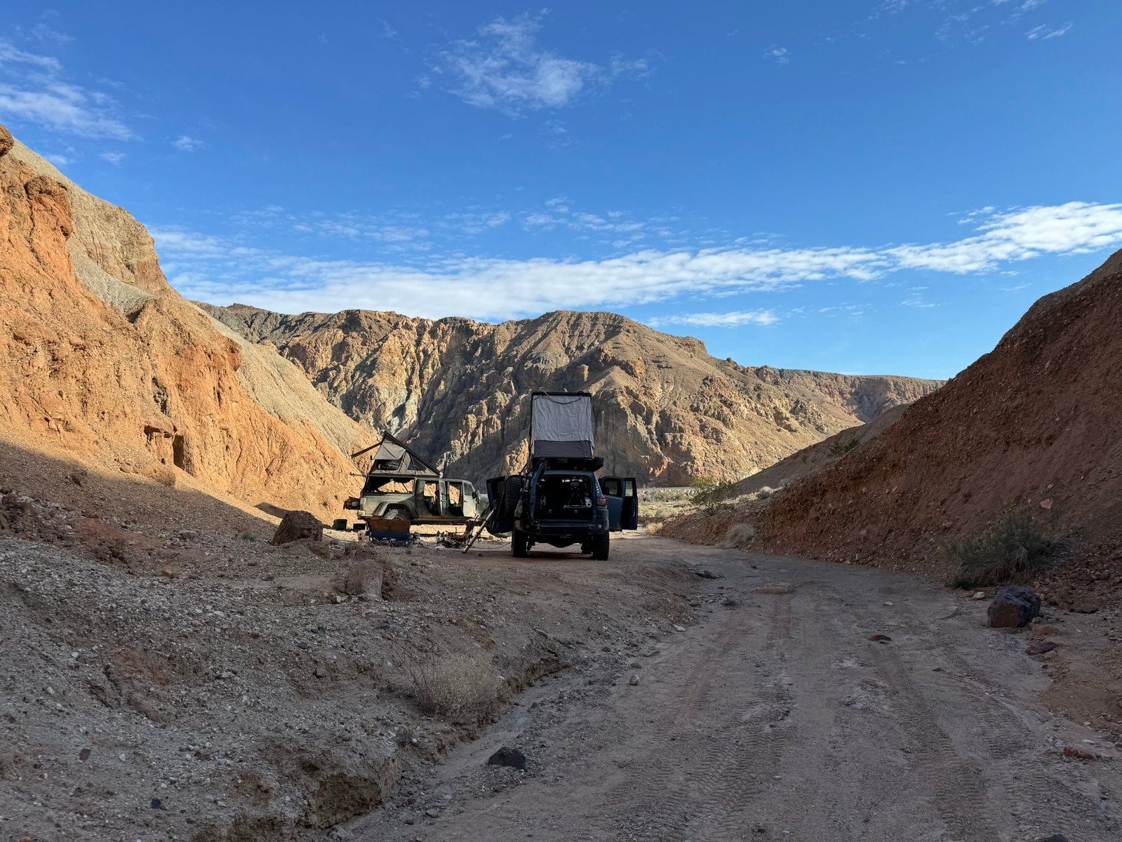 Gladiator and FJ camped in a canyon wash